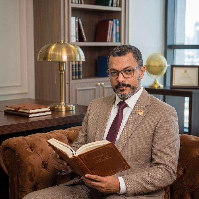 Mohamed Abo Khatwa, Senior Legal Counsel, reviewing case documents in his Dubai office